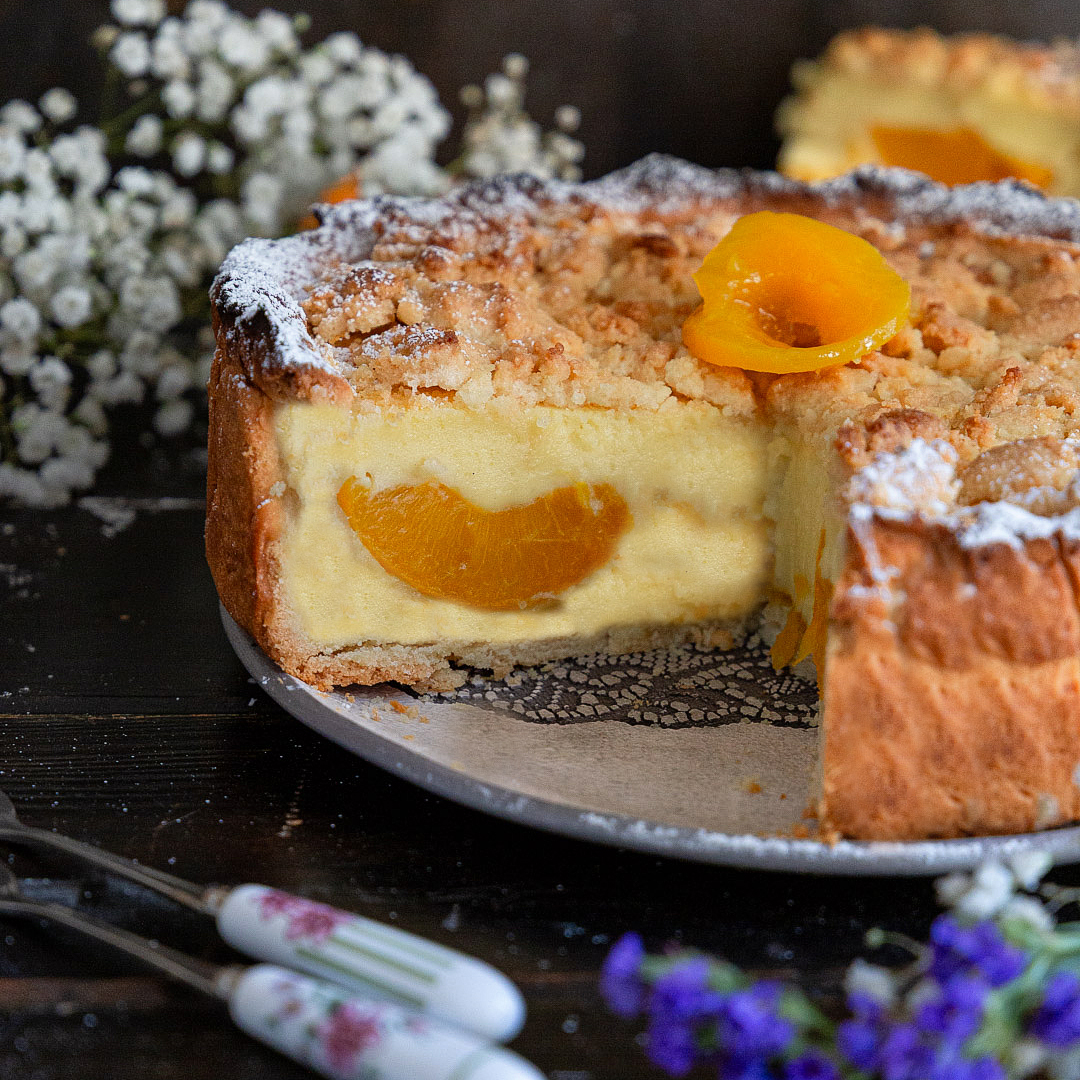 Immagine: Torta crumble vaniglia, mandorle e pesche sciroppate